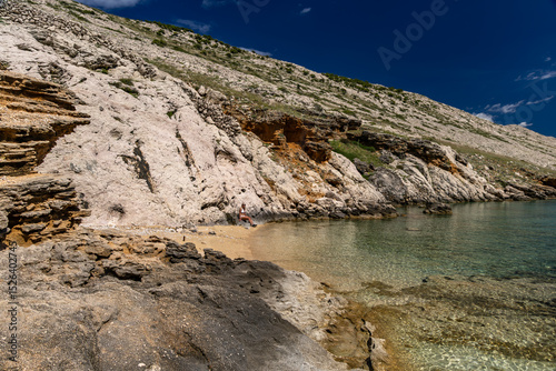Fototapeta Naklejka Na Ścianę i Meble -  Panorama of the bay with the Vela Luka beach below, view of the beach from the top of the mountain, rocky beach