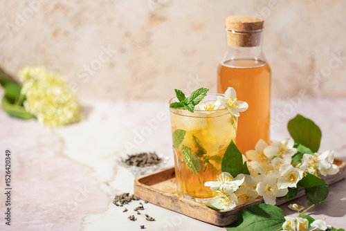 Jasmine green iced tea in a glass  on marble background