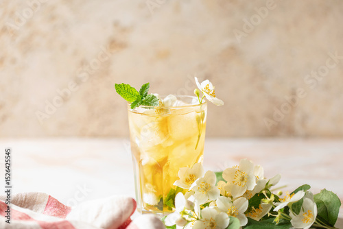 Jasmine green iced tea in a glass  on marble background