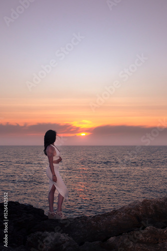 Sunset in Menorca with a girl in pastel tones