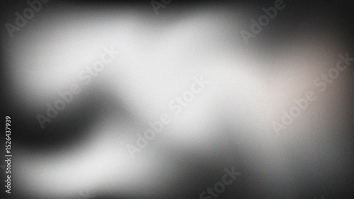 Abstract white light illuminating a black and gray textured gradient background