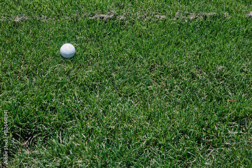 Close-up of perfectly manicured grass on golf course, vibrant green turf symbolizing precision, sport maintenance, and outdoor leisure environments photo