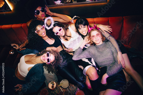 Group of friends at a fun night out in a lively atmosphere photo