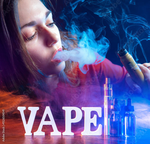 Woman vaper. Vape kit. Girl...