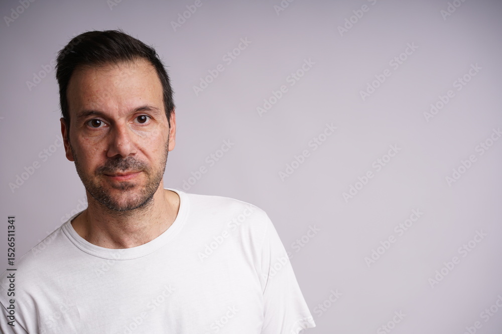 Fototapeta premium Male Model Showing Different Emotions on White Studio Background