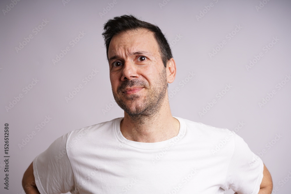 Obraz premium Male Model Showing Different Emotions on White Studio Background