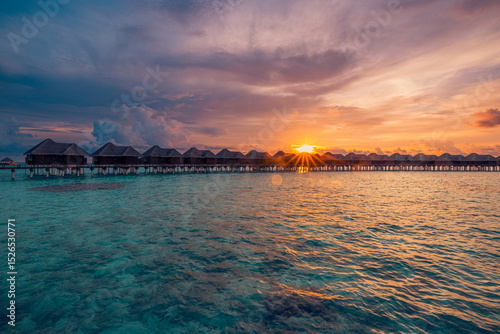 Фотография Stunning Maldives water villas sunset breathtaking sea bay view
