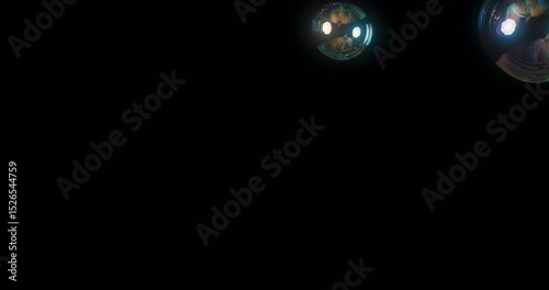 A captivating display of colorful soap bubbles floating against a deep black background, perfect for enhancing creative projects and stunning motion graphics that demand attention and beauty