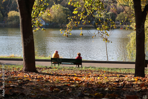 Autumn landscape on the lake in the city park.
