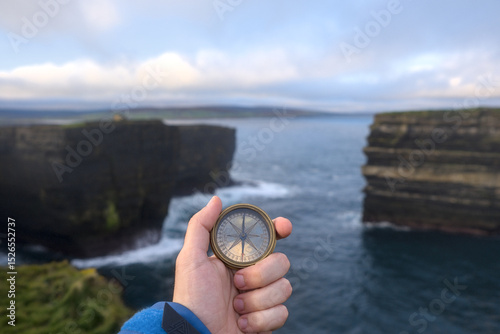 Compass on the cliffs of Downpatrick Head with the Atlantic Ocean Co. Mayo, Connacht province, Ireland.