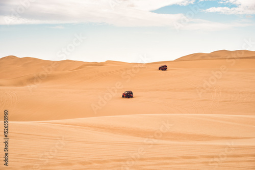 Fototapeta Naklejka Na Ścianę i Meble -  Buggy car on the sand dunes in the desert of Ica in Huacachina, Peru.