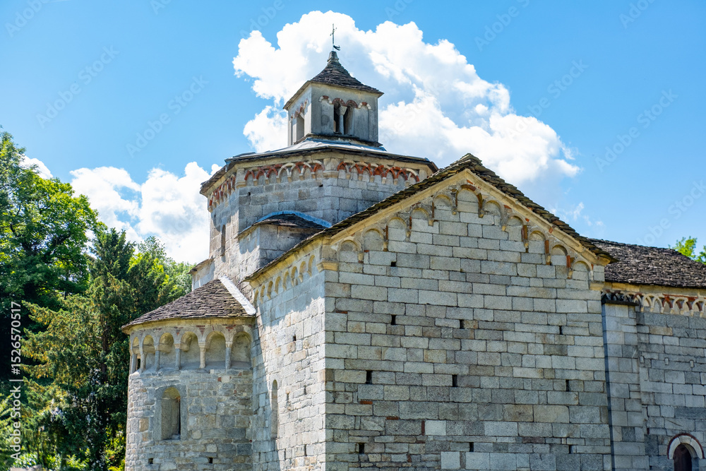 Fototapeta premium Historic Church San Giovanni Battista, stone 10th church, Picturesque Italian Montorfano village Charm, Province Verbano-Cusio-Ossola region Piedmont