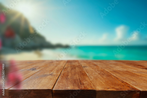 Empty wooden table with copy space on beach. Blurred sea and sky background. 