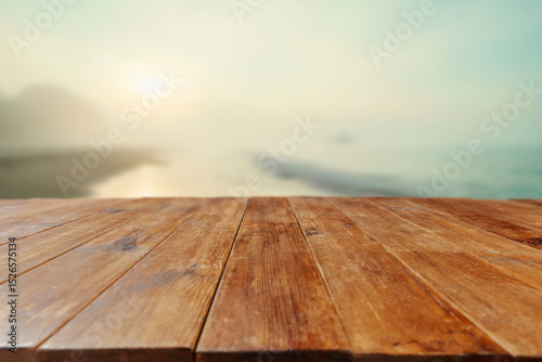 Fototapeta Naklejka Na Ścianę i Meble -  Empty wooden table with copy space on beach. Blurred sea and sky background. 
