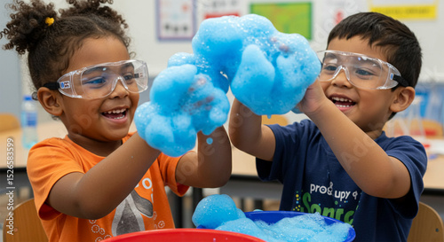 Joyful kids explore science with vibrant blue foam ecstatic learning experience