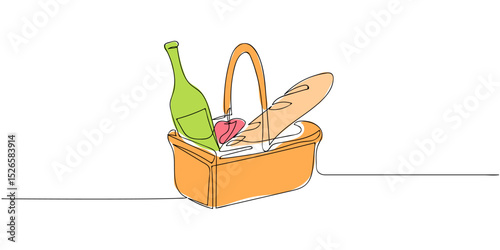 Basket containing wine, bread, cheese, and fruit prepared for a picnic in a sunny outdoor setting