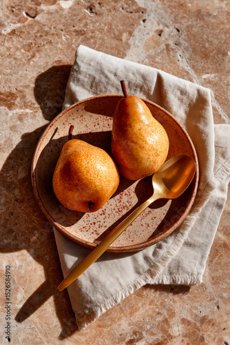 Rustic Still Life with Pears on Ceramic Plate and Linen Napkin