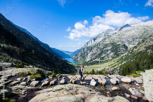 Young hiker woman in Vall de Boi, Aiguestortes and Sant Maurici National Park, Spain