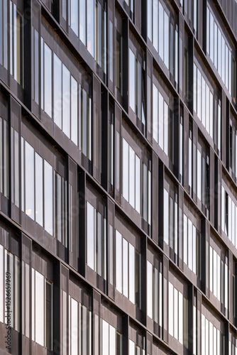 Wallpaper Mural Symmetrical facade with glass and concrete frames, repetitive structure and modern texture in soft light, perfect for background and urban design concepts Torontodigital.ca