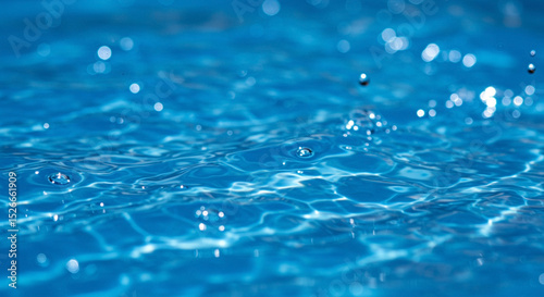 Sparkling Blue Water Surface Texture with Ripples and Droplets for Backgrounds