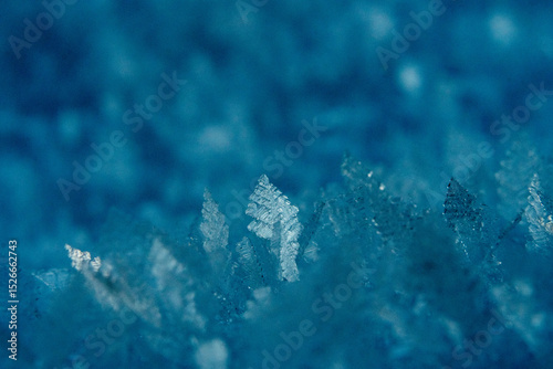 Close-Up of Beautiful Frost Patterns on Ice in Blue Tones