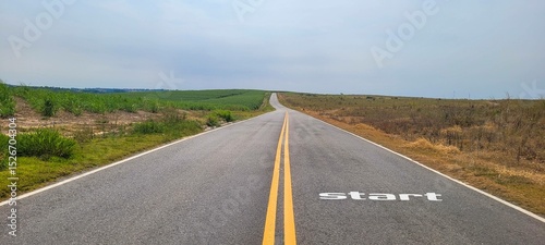 image of deserted road written start