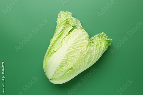 Fresh Chinese cabbage on green background, top view