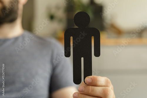 A man holds a simple black ...