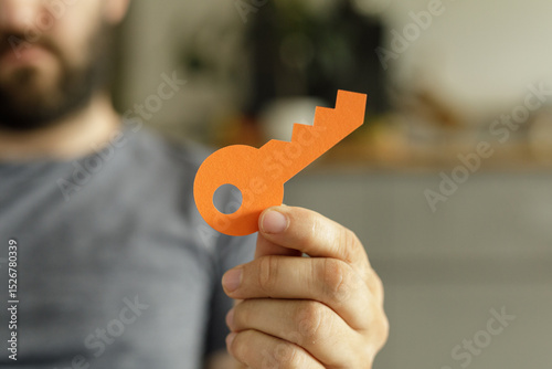 Image of a man holding a pa...
