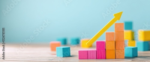 The colorful blocks and upward arrow represent growth and success in business.