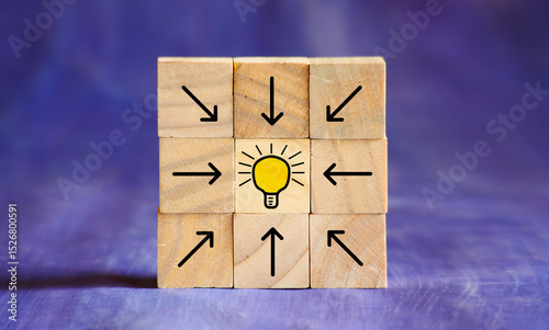 Business growth,success,human resources concept,arranged wooden cubes with arrows and lightbulb for planning development,ideas,innovation,leadership