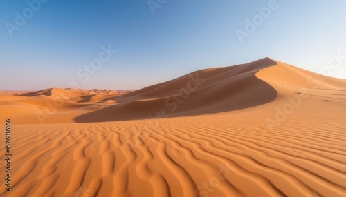 Golden sand dunes clear sky create mesmerizing patterns