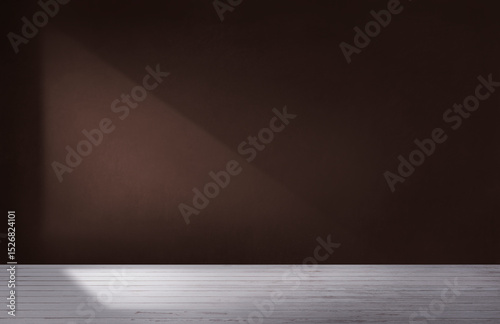 Dark brown wall in an empty room with concrete floor