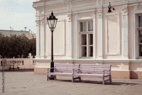 charming europeanstyle street cafe with colorful benches and single lantern as focal point photo