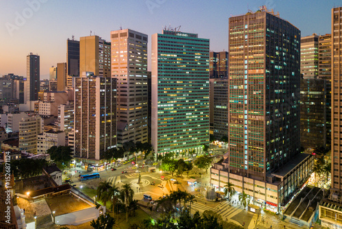 Skyline of Rio de Janeiro City Downtown With Office Buildings in the Evening and Carioca Square Below photo