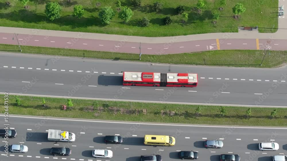 Red bus from driving in the city streets, top down aerial view, public transport, transportation system