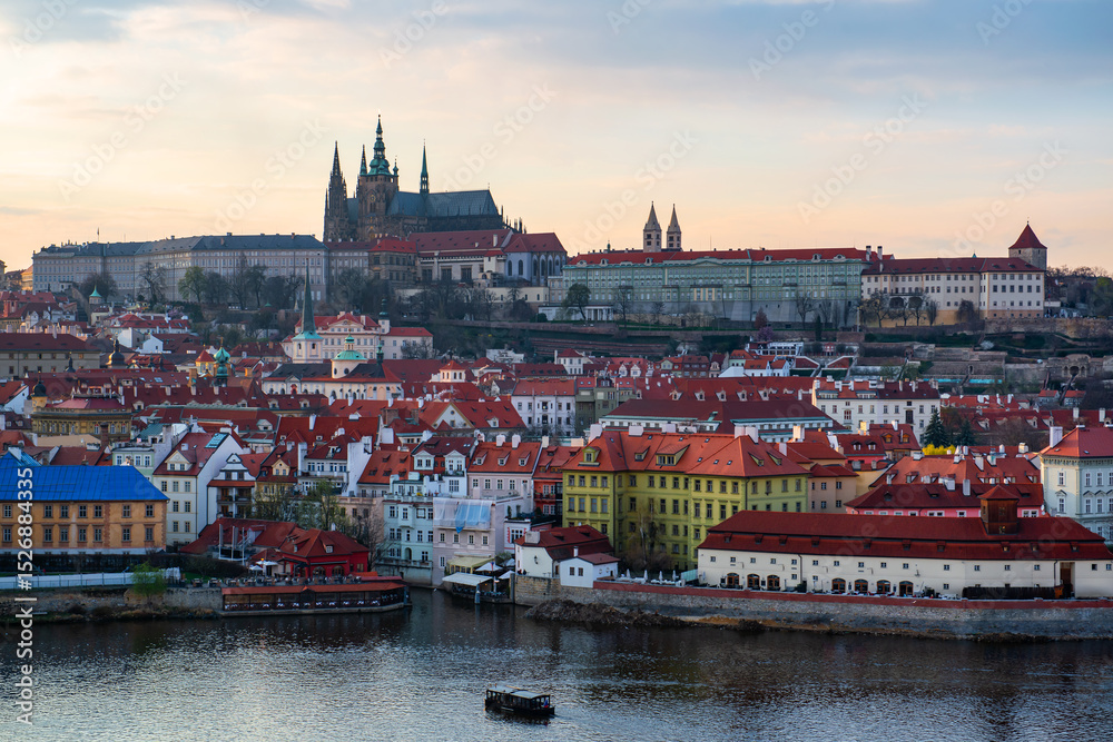 Obraz premium The Vltava River in the center of the Prague, Czech Republic, on a cloudy spring day