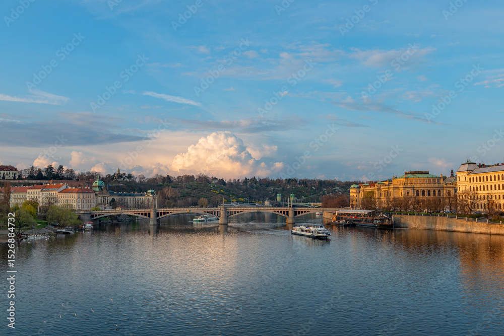 Obraz premium Picturesque view of the Vltava River in the center of the capital of the Czech Republic, Prague, on a spring day