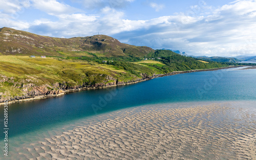 Aerial view of sand banks in a shallow bay with green coastline, Kyle of Tongue, Scotland