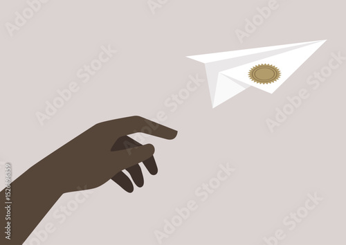 A hand gently releases a diploma paper plane, embodying aspirations and success as it takes flight into a world of possibilities and future endeavors