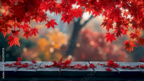 Autumn's Embrace: A wooden table overlaid with vibrant red maple leaves, framing the dreamy backdrop of an autumnal garden and foliage.