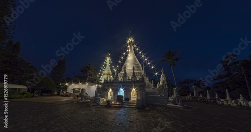 4K timelapse showing the transition from night to dawn at Wat Phra That Doi Kong Mu, Mae Hong Son, Thailand. Golden stupas glow against the morning sky.