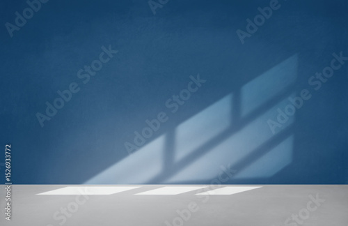 Blue wall in an empty room with concrete floor