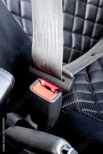 Seat belt fastened in a car.