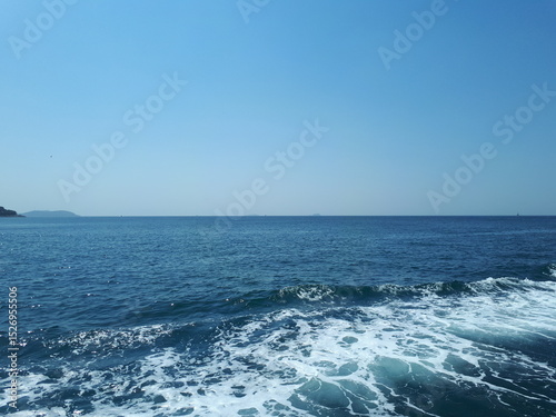 Fototapeta Naklejka Na Ścianę i Meble -  Idyllic seascape, blue sky and sea with waves.