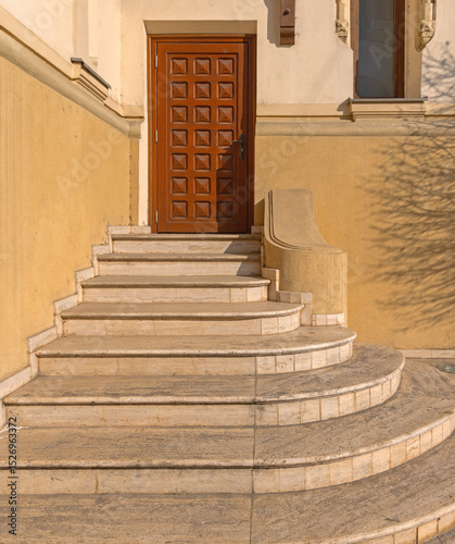 Round Stairs Structure Made From Stone House Entrance at Sunny Day