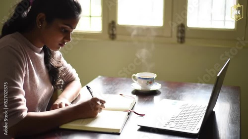 hispanic woman working on tablet computer