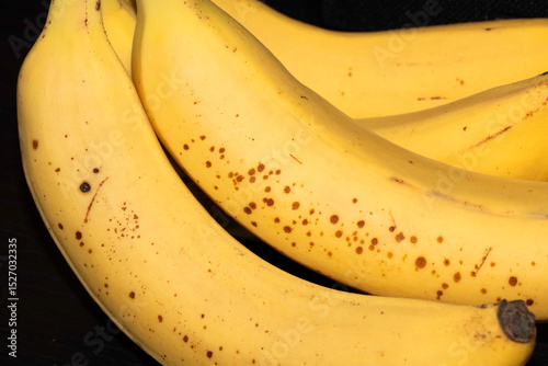 Fototapeta Naklejka Na Ścianę i Meble -  Close up of the yellow skin of a banana bunch