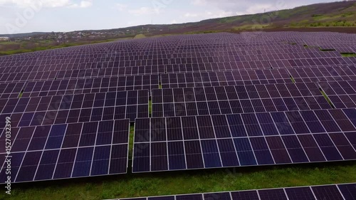 Solar panels absorb sunlight generating energy in vast field
