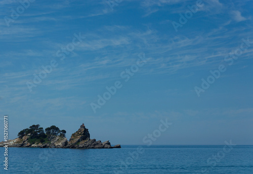 Sea view of the islands of Katic and Nedelja against the background of blue sky and calm sea